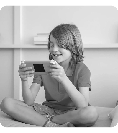 Boy playing a game on his phone