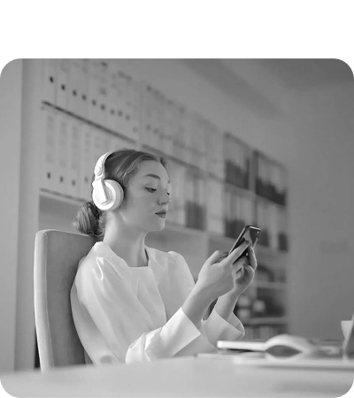 Teenager with headphones playing on a phone