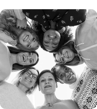 Group of smiling people looking down at the camera